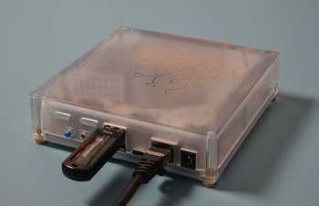 Image showing the flash drive and the Ethernet cable plugged into Home Assistant Yellow